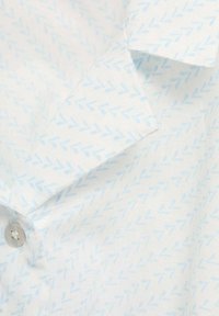 Button-up shirt in light blue and white with a repeating arrow pattern. Cotton fabric, smooth texture, with a folded collar.