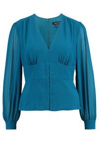 Blouse bleu-vert avec un décolleté en V, un corps ajusté et de longues manches transparentes. Présente un ruché aux épaules et une fermeture éclair au dos.