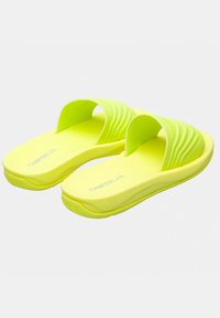 Two neon yellow slide sandals feature an open-toe design, ribbed strap texture, and a cushioned footbed with “CAMPERLAB” branding.