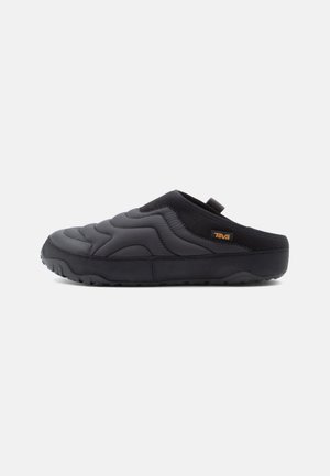 Black slip-on shoe featuring a quilted design, textured upper, and rubber sole. Includes pull tab for easy wear.