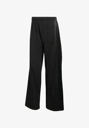 Pantalones deportivos negros con un corte relajado, que cuentan con bolsillos laterales con cremallera, rayas negras texturizadas y una cintura elástica para mayor comodidad.