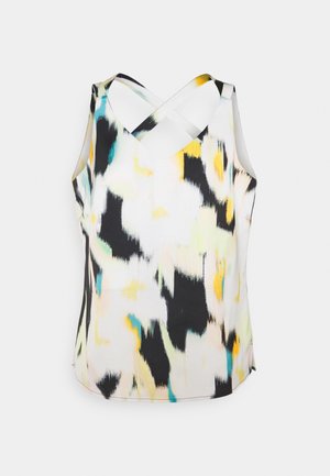 Blouse sans manches avec bretelles croisées dans le dos présentant un motif abstrait en noir, jaune, bleu et blanc.