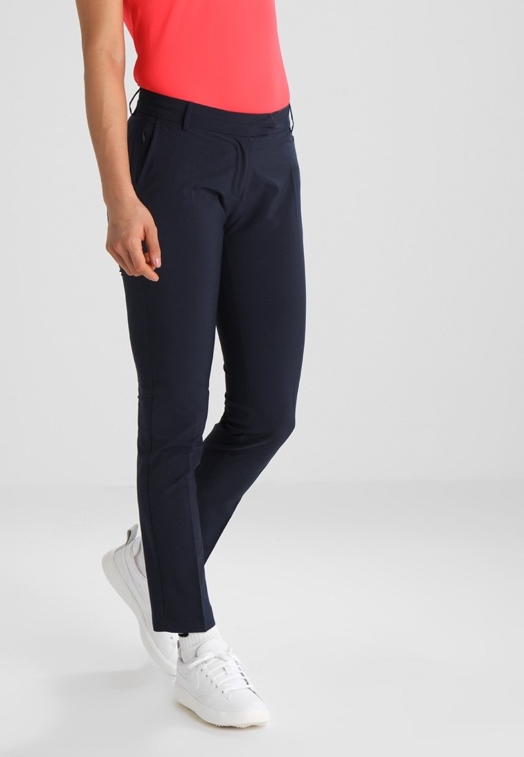 Marinblå skräddarsydda byxor i ett mjukt tyg, med en smal passform, platt front, två sidofickor och ett midjeresår med medelhög höjd.