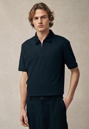 FLOCKED - Polo shirt - black pattern collar