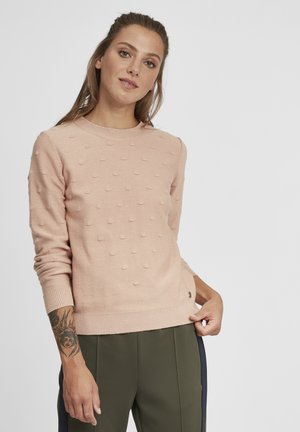 Lys rosa genser med teksturert bobledesign, rund hals, lange ermer, og ribbestrikkede ermer og kant. Diskret merkevaredetalj nederst.