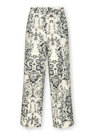 Pantalones de tiro alto y pernera ancha con un delicado estampado floral y paisley en blanco y negro sobre un fondo crema.