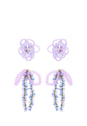 Pairs of purple beaded floral earrings with looped petals on top and cascading bead strands below on white background.