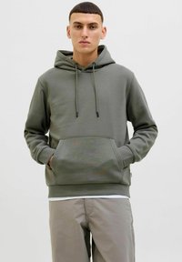 Olive green hoodie made from soft fabric, featuring a kangaroo pocket, adjustable drawstrings, and ribbed cuffs. Casual, simple design.