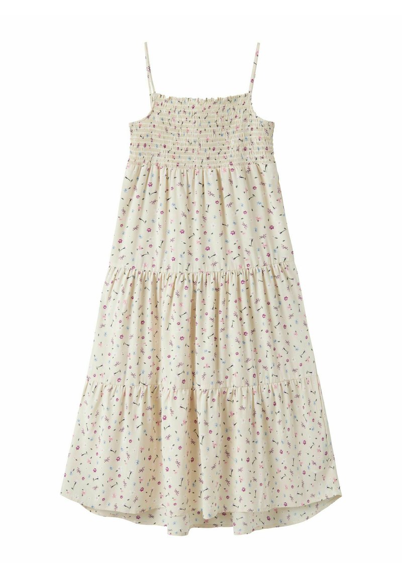 Κρεμ φόρεμα χωρίς μανίκια με λεπτές τιράντες, μπούστο με σφηκοφωλιά, φούστα με βολάν και μικρό σχέδιο λουλουδιών σε ροζ, μοβ και μπλε.