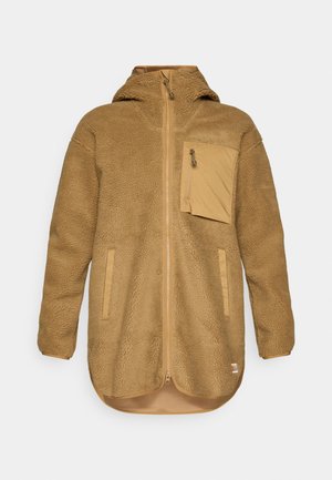 Tan fleece jacket with a zippered front, hood, and chest pocket. Features a textured fabric and contrasting trim around the edges.