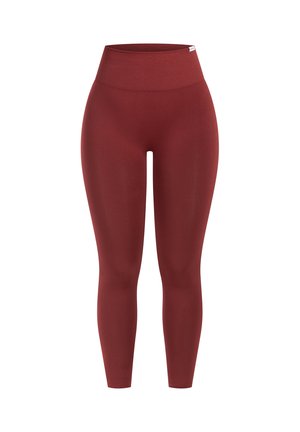 High-waisted, form-fitting leggings in a deep red color, made of smooth, stretchy material with a wide waistband for comfort.