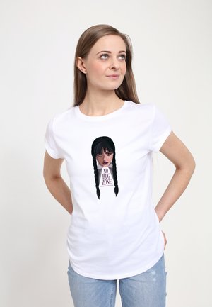 White cotton t-shirt featuring an illustration of a girl with long black hair in braids, text "NO HUG ZONE" beneath her face in dark purple.