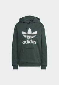 Mörkgrön hoodie i bomull med en känguruficka, justerbar dragsko på huvan, och en stor vit Adidas-logotyp med bladdesign.