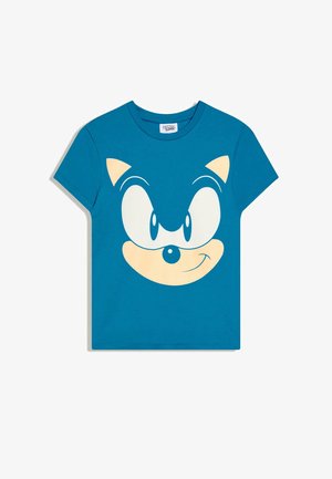 Blauw T-shirt met korte mouwen en een grote afbeelding van het glimlachende gezicht van Sonic the Hedgehog op de voorkant.