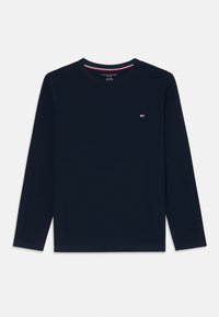 Navy long-sleeve shirt made of cotton, featuring a round neckline and a small embroidered logo on the left chest. Solid color, no patterns.
