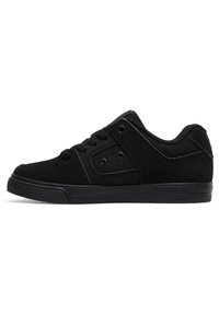 Black suede low-top sneakers with a textured finish, round toe, flat laces, and contrasting eyelets on the outer side. Rubber sole.