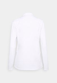 Langärmliges Poloshirt in Weiß, mit klassischem Kragen und glatter Textur. Auf der Rückseite sind keine sichtbaren Muster oder Akzente.