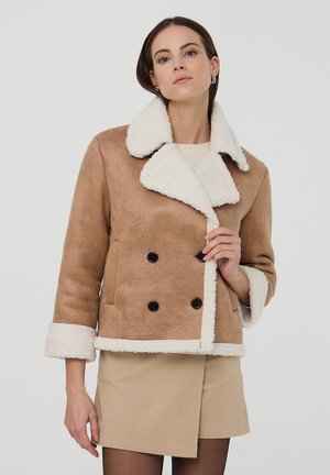 Giacca in similpelle - beige