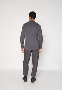 adidas Originals MANCHESTER UNITED ICON DPANT - Klub merchandise - utility black