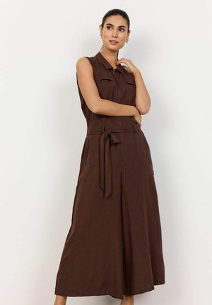 Brown sleeveless jumpsuit with a collared neckline, belted waist, and two front pockets; made of a textured fabric with a relaxed fit.