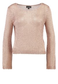 Světle růžový pletený svetr s dlouhými rukávy, kulatým výstřihem a zkráceným střihem. Texturovaný materiál s volnou vazbou a žebrovanými manžetami.