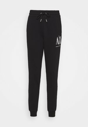 Pantalones jogger negros con cintura de cordón y logotipo blanco "A|X Armani Exchange" en la parte superior del muslo izquierdo, puños ajustados.