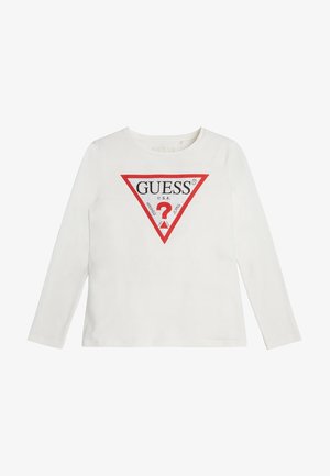 Valkoinen pitkähihainen t-paita, jossa on punainen ja musta kolmion muotoinen logo strassikoristeilla sekä pyöreä pääntie.