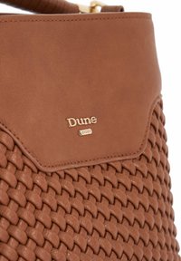 Brown woven leather handbag with a smooth top section. Features gold logo "Dune London" on the front, highlighting texture and craftsmanship.