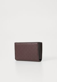 Maroon textured wallet with a geometric pattern, featuring multiple card slots and a slim profile for easy storage.