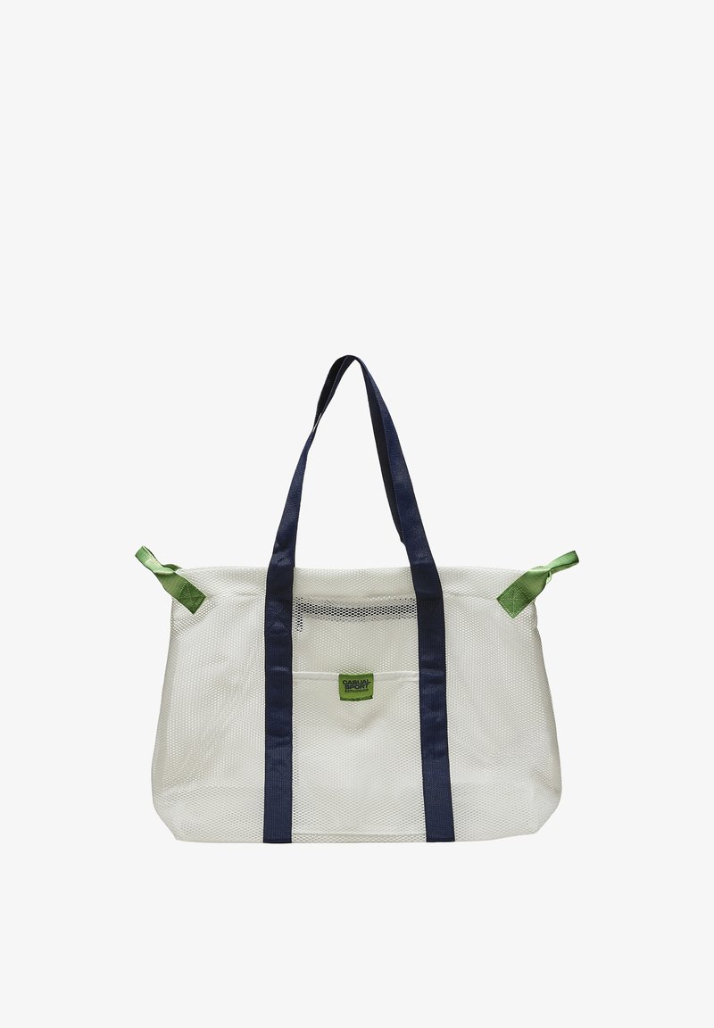 Sac cabas en mesh blanc avec anses bleu marine et languettes vertes aux coins, avec un petit patch logo vert "Casual Sport" sur la poche avant.