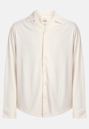 Cream-colored, long-sleeve button-up shirt with a textured striped design and a notched collar. Features a rounded hem and button accents.
