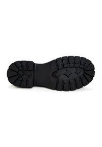 Semelle de bottes en caoutchouc noir avec des sculptures profondes et des motifs en forme d’étoile au centre, conçue pour l’adhérence et la durabilité.
