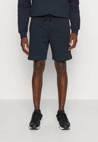 Under Armour RIVAL FLEECE - Sports shorts - black/white