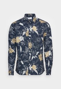 Camicia blu navy con bottoni, decorata con motivo floreale in bianco e oro, caratterizzata da maniche lunghe, colletto classico e chiusura frontale con bottoni.