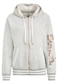 Felpa con zip grigia chiara, con cordini bianchi, tasche a marsupio, polsini e fondo a righe, e testo "Bench." in rosa dorato sulla manica sinistra.