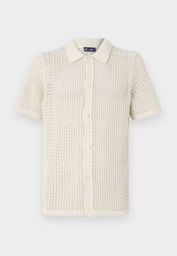 Cardigan en maille crème à manches courtes avec un motif texturé à mailles ouvertes, boutons sur le devant et col et poignets côtelés.