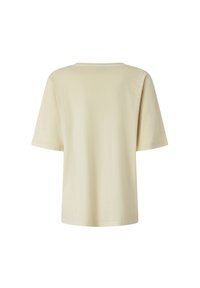 Krem-podraženi kratki rukav T-shirt s okruglim izrezom, izrađen od mekog, glatkog materijala, s opuštenim krojem i minimalnim šavovima.