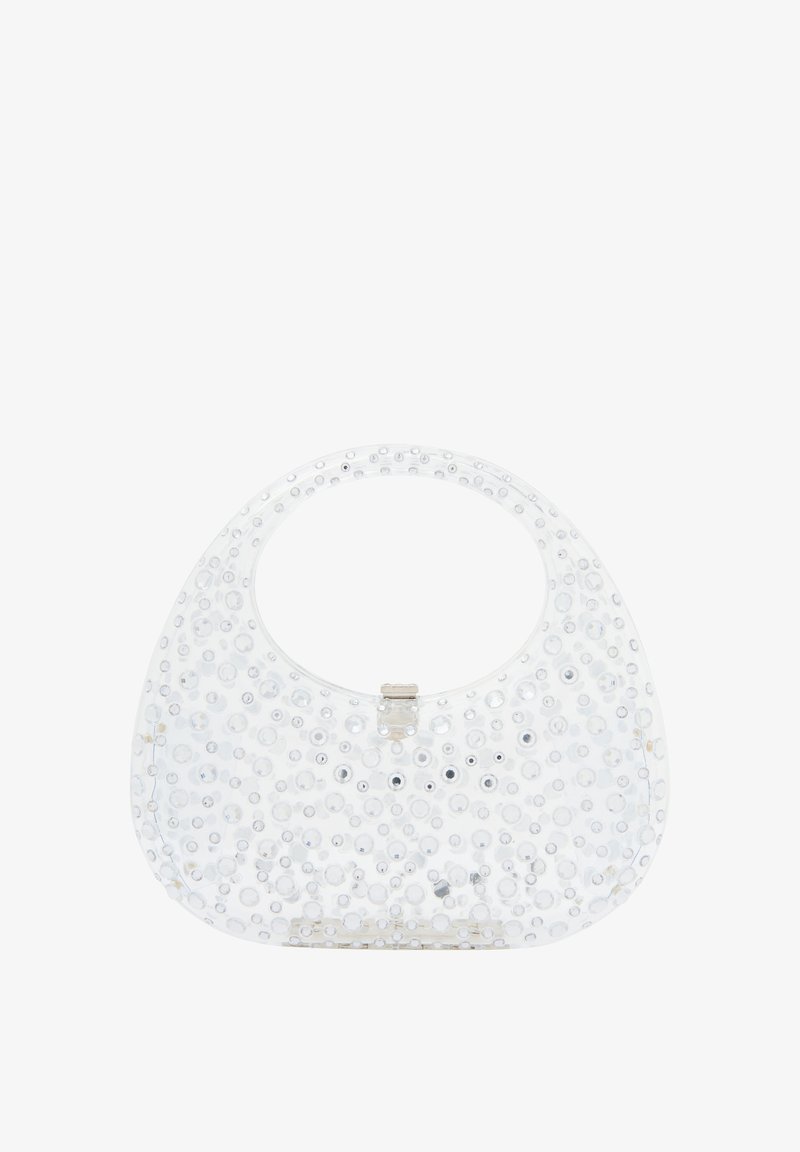 Átlátszó kézitáska kör alakú fogantyúval, fényes kör alakú szegecsekkel díszítve, elöl ezüst csattal és sima felülettel.