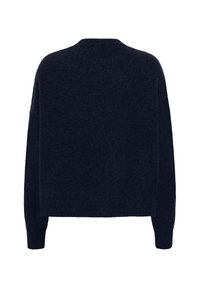 Modrá pletená svetrová košeľa s okrúhlym výstrihom a dlhými rukávmi, s voľným strihom a jemnou textúrou. Bez viditeľných log alebo dekorácií.