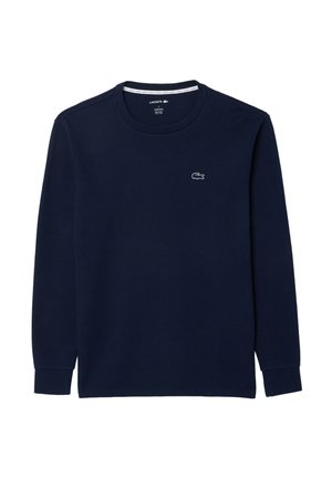 Marineblauw shirt met lange mouwen en ronde hals, met klein wit Lacoste krokodillenlogo op de linkerborst.