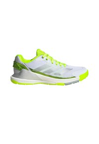 White athletic shoe with neon green accents. Mesh upper, cushioned sole, textured design, and a lightweight construction.