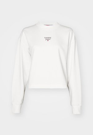 Fehér, rövidített pulóver hosszú ujjal és magas gallérral. Az elülső részen apró, bordó "tommy jeans" logó található. Sima textúrájú.