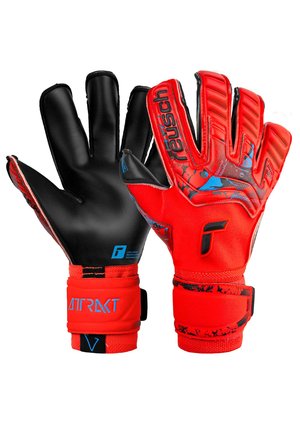 Red goalkeeper gloves with black latex palms, finger protection, and textured grip. Adjustable wrist straps with blue branding accents.