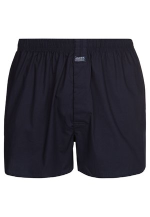 Marineblauwe boxershorts van zachte stof, met een elastische tailleband, een opening aan de voorkant en een klein logo-label op de tailleband.