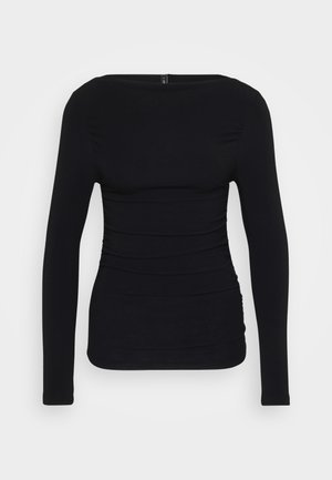 Black long-sleeve top made from stretchy fabric, featuring a boat neckline and gathered detailing along the sides for a fitted look.