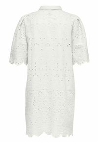 Robe en dentelle blanche avec manches courtes bouffantes, ourlet festonné, broderie ajourée et col classique, vue de dos.