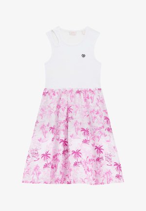 Witte geribde jurk met een rok met een roze palmboomprint. Voorzien van een kleine hartvormige metalen accenten op de borst. Van een katoenmix.