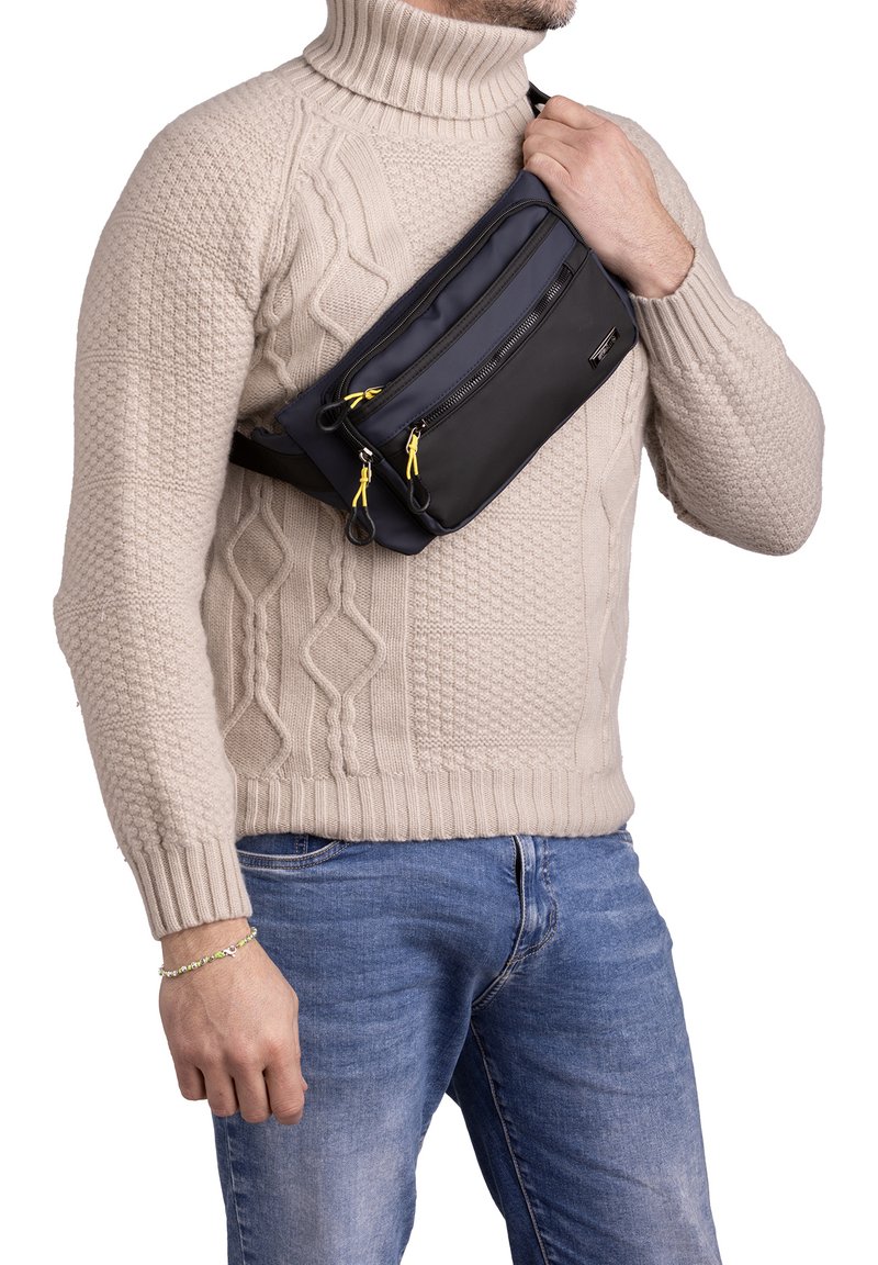 Borsa a tracolla nera e blu con texture liscia, due scomparti con zip, nastri gialli per le zip e tracolla regolabile.