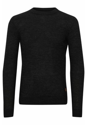 Maglione nero con maniche lunghe, collo rotondo, texture a coste e leggere macchie. Presenta un piccolo logo sulla parte inferiore.