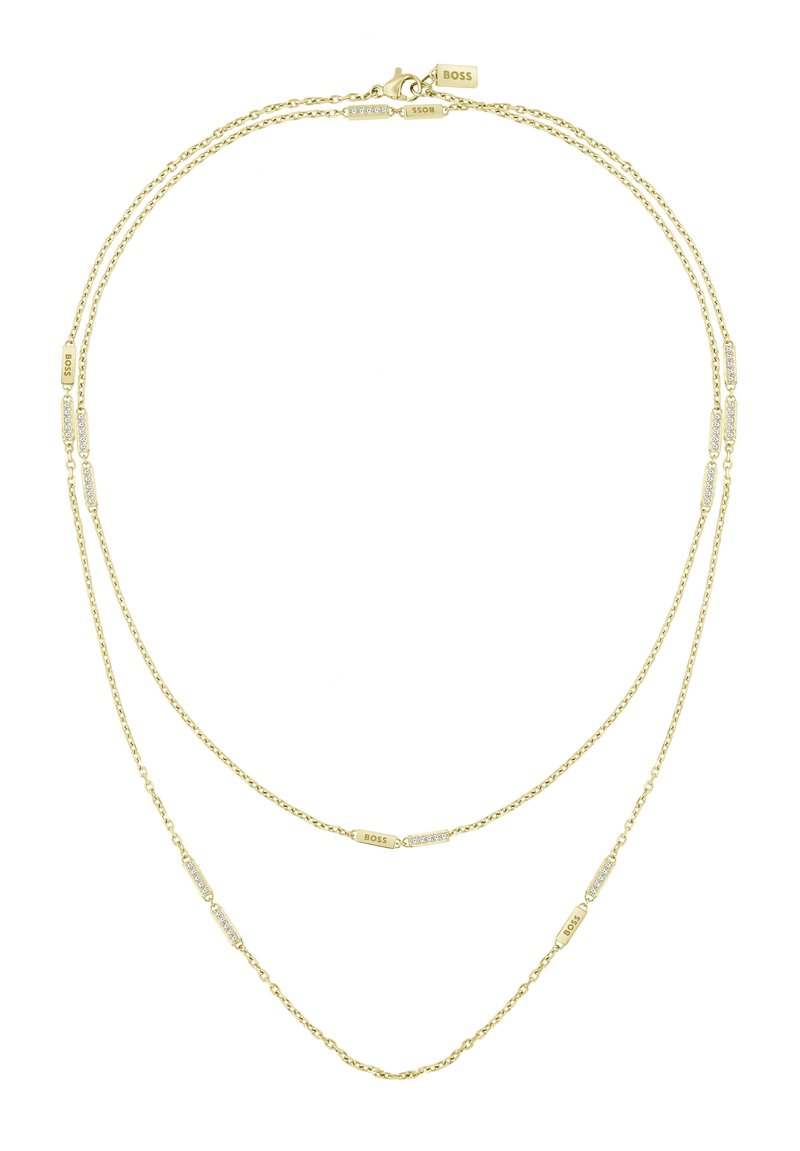 Gelaagde gouden ketting met twee delicate kettingen en rechthoekige accenten, sommige versierd met kleine heldere edelstenen; sluithardware zichtbaar.